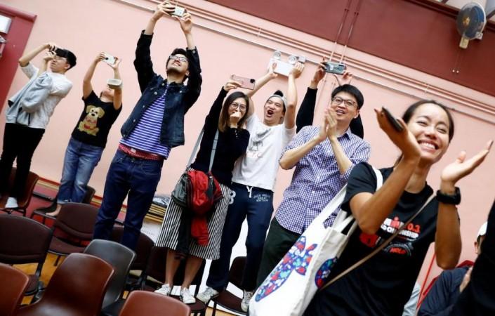 Supporters of local candidate Kelvin Lam celebrate, after it was announced that he won the local council elections in his district, at a polling station in South Horizons West district in Hong Kong, China November 25, 2019. Hong Kong elections