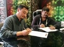 Ram Gopal Varma signing the deal of Enter The Girl Dragon with his Chinese partner