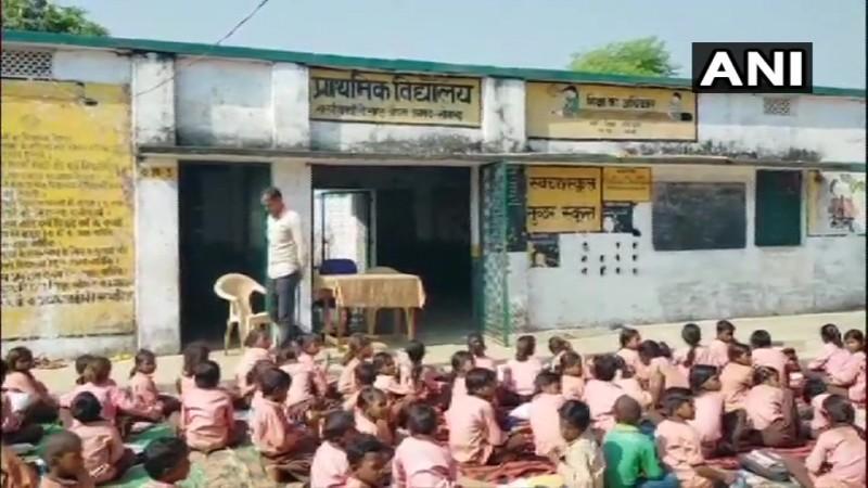 Image: UP school children wait for mid day meals. ANI UP SCHOOL