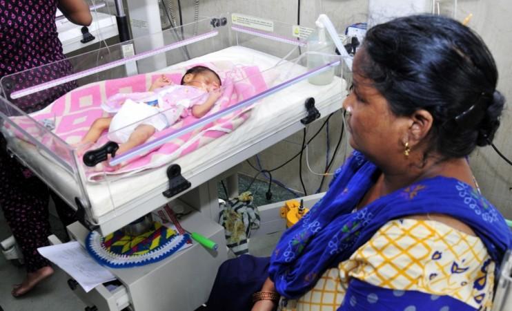 A new born baby kept under observation at an Amritsar hospital on July 11, 2017. World Population Day is observed on 11th July. Cesarean kid
