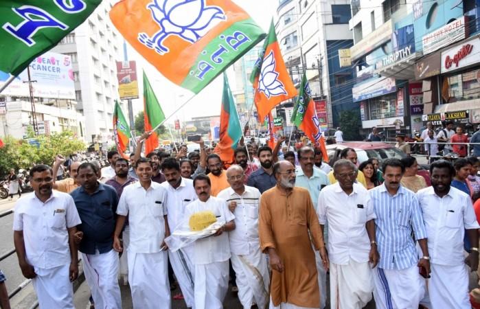 Alphons Kannanthanam and BJP workers celebrate as the party led by PM Narendra Modi was set to retain power for another five years after making a sweep of the Lok Sabha battle and mauling the opposition. Kerala BJP
