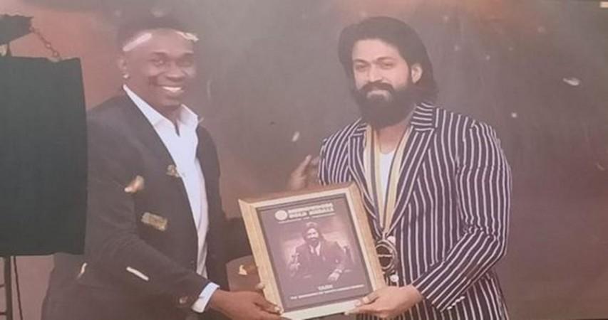 Cricketer DJ Bravo presenting award to Yash Cricketer DJ Bravo presenting award to Yash