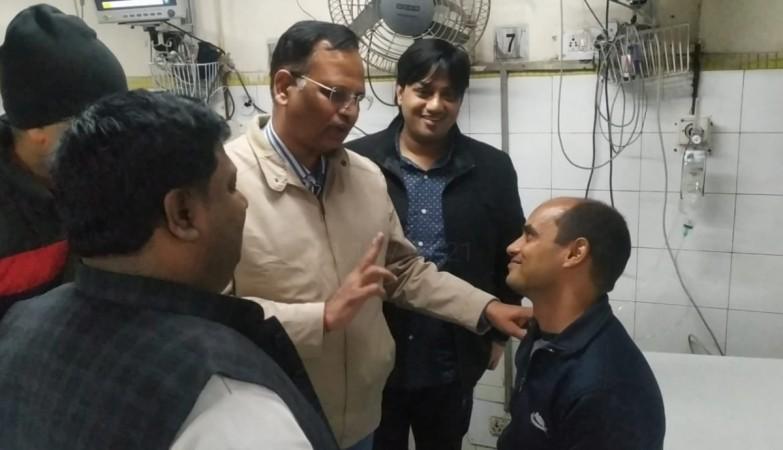 Fireman Rajesh Shukla with Delhi Home Minister Satyendra Jain. Rajesh Shukla