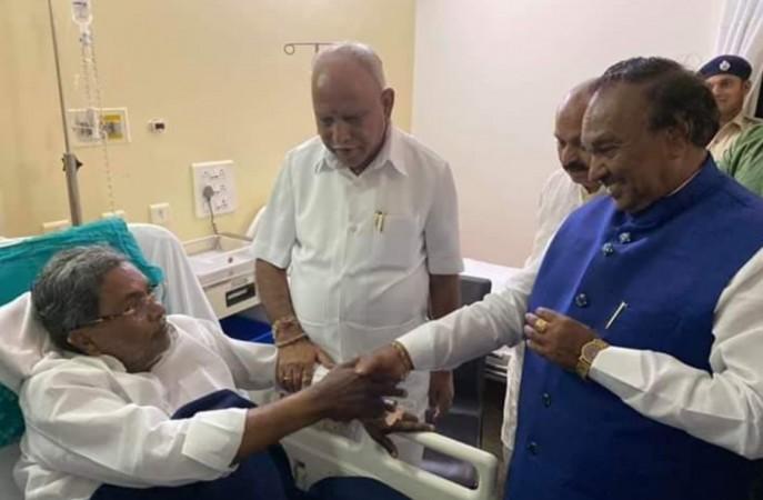 Karnataka CM BS Yediyurappa and other BJP leaders visited Congress leader Siddaramaiah who is admitted in a hospital. Karnataka CM BS Yediyurappa and other BJP leaders visited Congress leader Siddaramaiah who is admitted in a hospital.