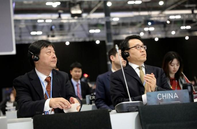 Members of the China delegation attend a plenary session during the ongoing climate negotiations. China delegation at UN
