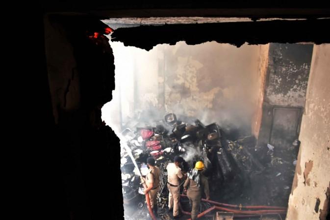 Firefighters douse fire that broke out at a warehouse. Delhi fire