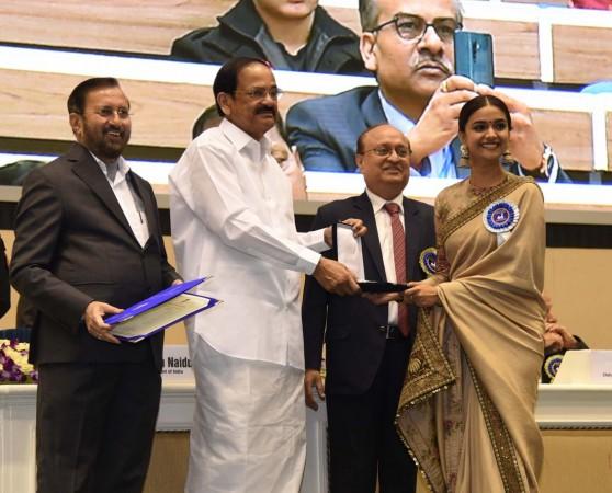 Keerthy Suresh receiving award from Vice President of India, Venkaiah Naidu. Keerthy Suresh