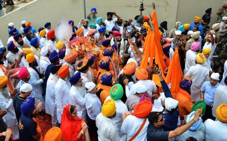 President Droupadi Murmu paid floral tributes to Bhagwan Birsa Munda at Parliament House in New Delhi on his birth anniversary, observed nationwide as 'Janjatiya Gaurav Divas.' Sikh devotees