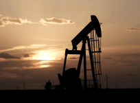 Oil pump jacks work at sunset near Midland, Texas, US. Reuters