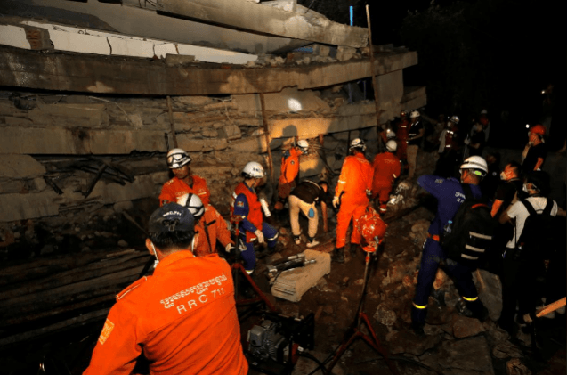 A rescue team searches for trapped workers at a collapsed building, which was under construction in Kep, Cambodia January 3, 2020. A rescue team searches for trapped workers at a collapsed building, which was under construction in Kep, Cambodia January 3, 2020.