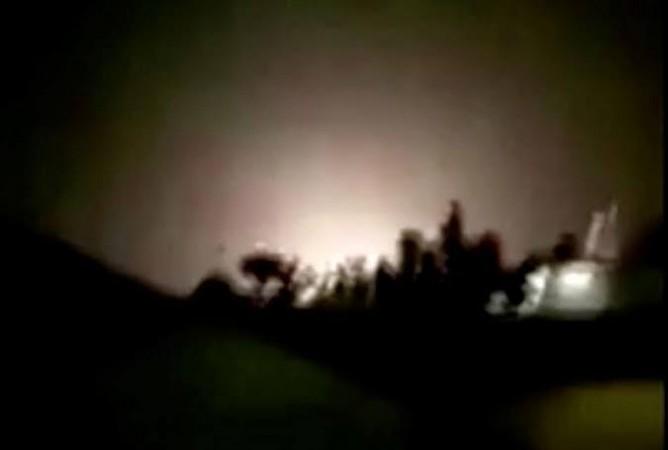 An explosion is seen following missiles landing at what is believed to be Ain al-Asad Air Base in Iraq. Iran attacks US forces