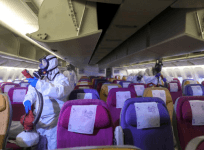 Members of the Thai Airways crew disinfect the cabin of an aircraft of the national carrier during a procedure to prevent the spread of the coronavirus at Bangkok's Suvarnabhumi International Airport, Thailand, January 28, 2020.