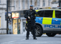 A Police officer is seen near a site where a man was shot by armed officers in Streatham, south London, Britain, February 2, 2020. REUTERS/Simon Dawson