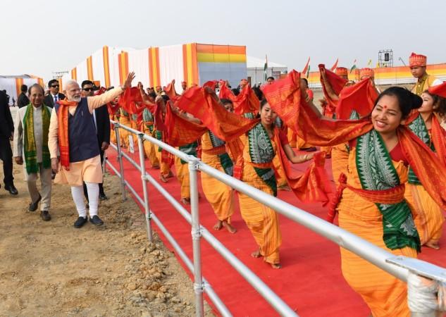 PM Modi was welcomed by hundreds of Bodo girls who performed the traditional 'Bagurumba' dance. Narendra Modi in assam