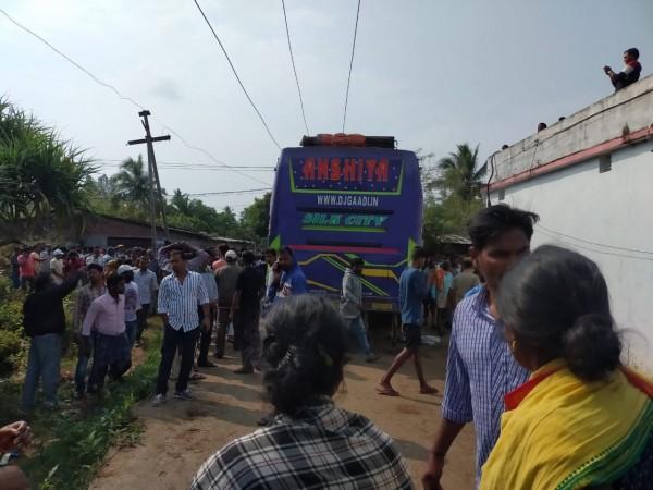Ganjam: Locals gather at the site where a bus came in contact with an 11 KV power transmission line, electrocuting five passengers to death and injuring over 30, in Odisha's Ganjam district on Feb 9, 2020. The accident took place near Nandarajpur under the Golanthara police limits of Ganjam district. odisha bus