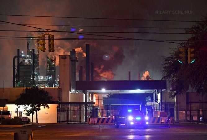 Photos from Scenic Highway show large plumes of black and white smoke as crews battle a large fire at the Exxon Refinery in Baton Rouge. @hscheinukphoto/Twitter Exxon Fire
