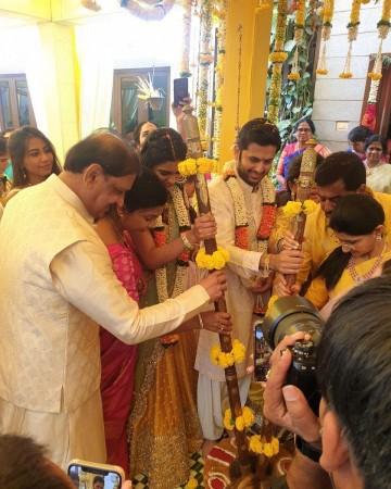Nithiin, Shalini and their parents take part in rituals. Nithiin