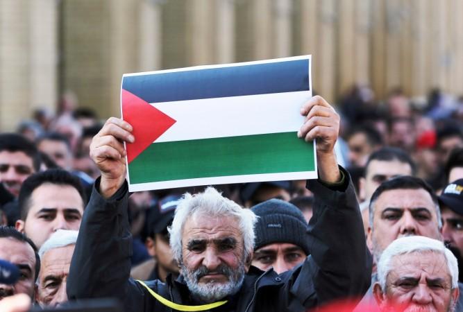 BAGHDAD, Jan. 31, 2020 (Xinhua) -- Iraqi people take part in a protest against the announced U.S. Middle East peace plan in Baghdad, Iraq, on Jan. 31, 2020. (Xinhua/Khalil Dawood/IANS) BAGHDAD, Jan. 31, 2020 (Xinhua) -- Iraqi people take part in a protest against the announced U.S. Middle East peace plan in Baghdad, Iraq, on Jan. 31, 2020. (Xinhua/Khalil Dawood/IANS)