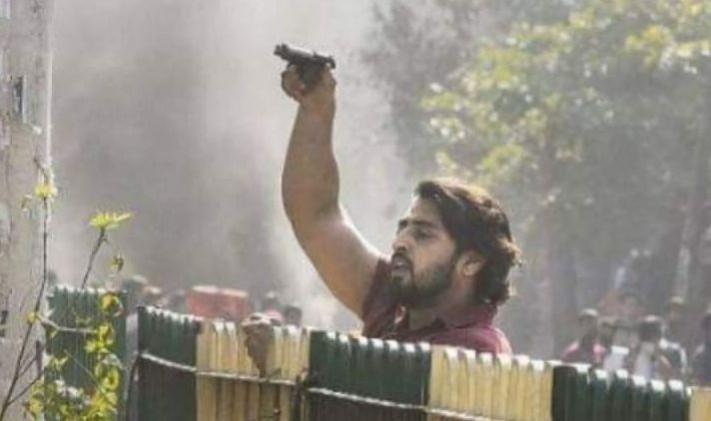 An unidentified youth seen with a gun at east Delhi's Maujpur on Feb 24, 2020. delhi riots