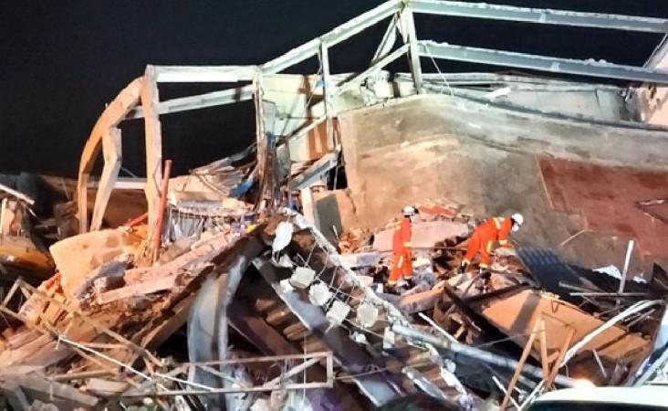 Rescue workers looking for survivors under the rubble of Chinese hotel used as a coronavirus quarantine facility. China Hotel Collapse