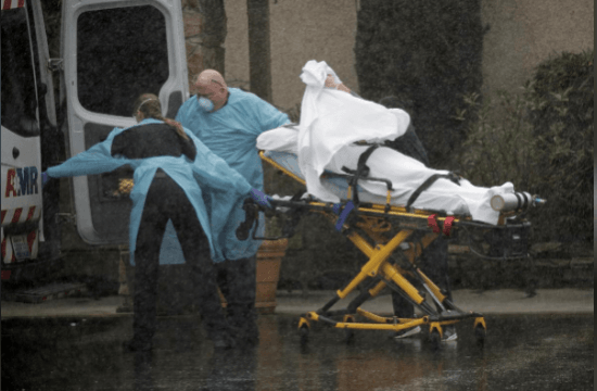 Medics transport a patient through heavy rain into an ambulance at Life Care Center of Kirkland, the long-term care facility linked to several confirmed coronavirus cases in the state, in Kirkland, Washington, U.S. March 7, 2020. REUTERS/David Ryder Medics transport a patient through heavy rain into an ambulance at Life Care Center of Kirkland, the long-term care facility linked to several confirmed coronavirus cases in the state, in Kirkland, Washington, U.S. March 7, 2020. REUTERS/David Ryder