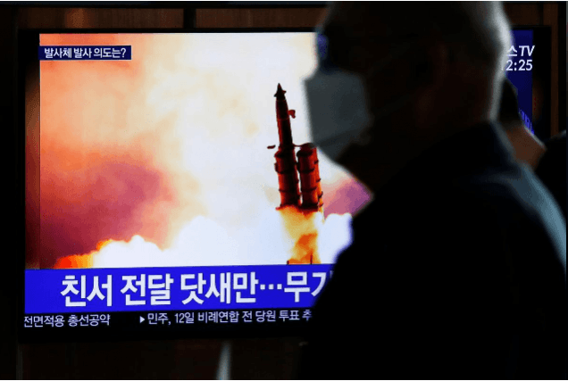 A man walks past a TV broadcasting file footage for a news report on North Korea firing an unidentified projectile, in Seoul, South Korea, March 9, 2020. REUTERS/Heo Ran A man walks past a TV broadcasting file footage for a news report on North Korea firing an unidentified projectile, in Seoul, South Korea, March 9, 2020. REUTERS/Heo Ran