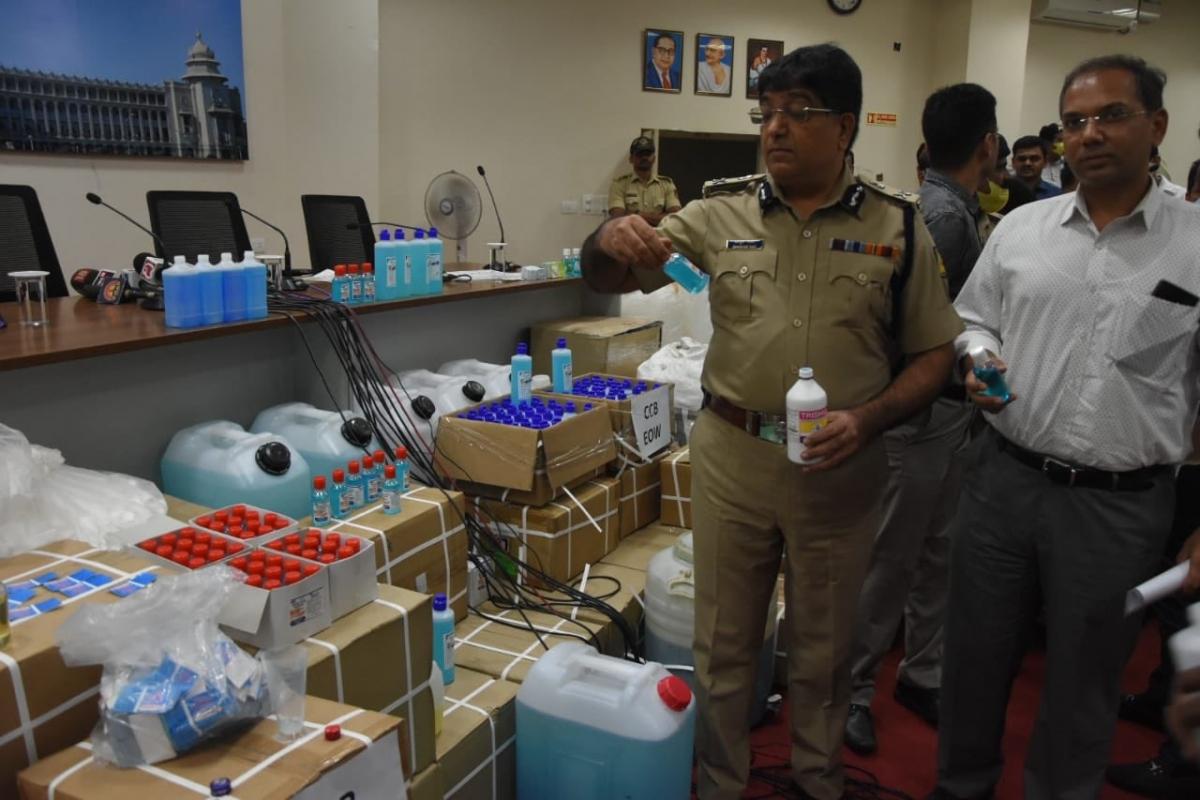 Bengaluru City Police Commissioner, IPS officer, Bhaskar Rao scans through the seized stock. BCP