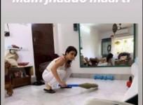Fatima Sana Sheikh sweeping the floor