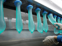 A worker performing a test on condoms at Malaysia's Karex condom factory in Pontian, 320 km southeast of capital Kuala Lumpur, on November 7, 2012