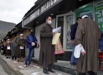 Baramulla: People strictly practising social distancing while they queue up to buy medicines outside a medical store during 21-day long nationwide lockdown imposed as a precautionary measure to contain the spread of COVID-19, in Jammu and Kashmir's Baramu
