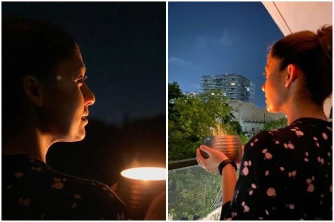 Nayanthara holding diyas in support of PM Modi's call to fight darkness during Coronavirus outbreak. Nayanthara