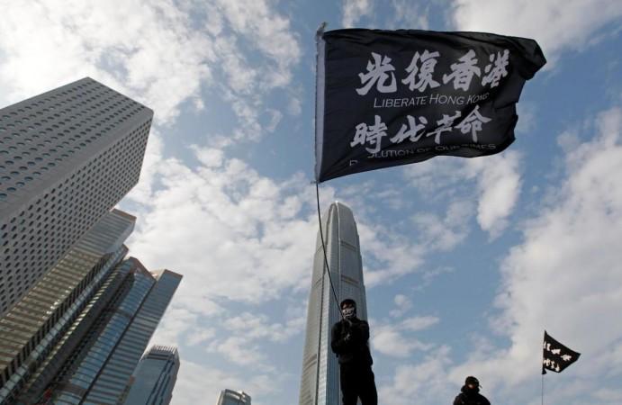 An anti-government protester waves a flag during a protest at Edinburgh Place in Hong Kong, China, January 12, 2020. REUTERS/Navesh Chitrakar/Files An anti-government protester waves a flag during a protest at Edinburgh Place in Hong Kong, China, January 12, 2020. REUTERS/Navesh Chitrakar/Files