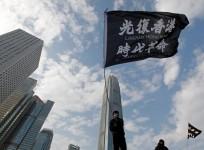 An anti-government protester waves a flag during a protest at Edinburgh Place in Hong Kong, China, January 12, 2020. REUTERS/Navesh Chitrakar/Files
