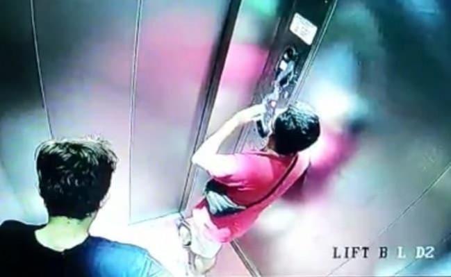 Two Vietnamese nationals spotted in an apartment lift in Mangaluru. ANI Mangaluru