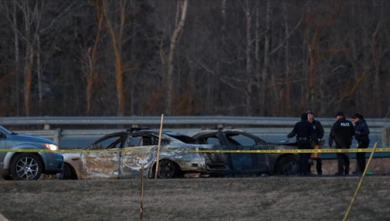RCMP officers go over a car collision scene involving the fake RCMP car driven by Gabriel Wortman in Shubenacadie, Nova Scotia, Canada April 19, 2020. Reuters. Nova Scotia shooting