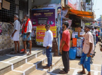 people waiting outside liquor shops during lockdown