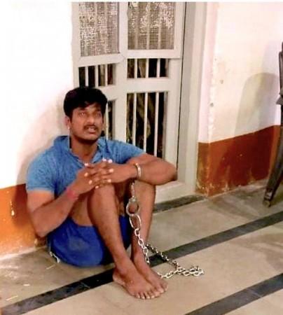 CRPF jawan sitting chained in Belagavi police station Twitter