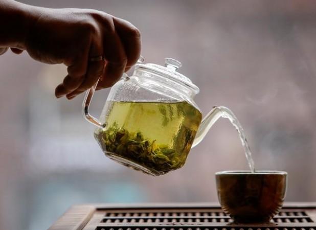The owner of a tea house pours a cup of tea in this picture illustration taken April 25, 2020. The owner of a tea house pours a cup of tea in this picture illustration taken April 25, 2020.