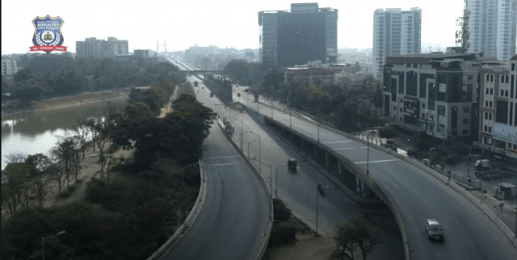 The video begins with a wide shot of the huge city of Bengaluru and goes to speak on its history. bangalore