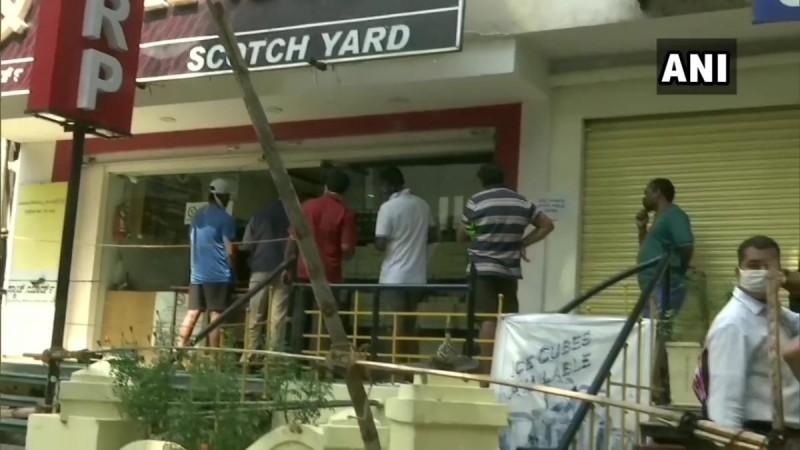 long queues in front of liquor shops