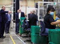U.S. President Donald Trump points as he watches workers on the assembly line manufacturing protective masks for the coronavirus disease (COVID-19) outbreak during a tour of a Honeywell manufacturing facility in Phoenix, Arizona, U.S., May 5, 2020. REUTER