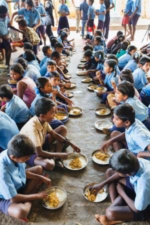 School children eating millet during a pilot feeding trial (before COVID-19) School children eating millet during a pilot feeding trial (before COVID-19)