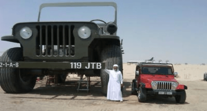 Rainbow sheikh with one of his crazy car models Rainbow prince with one of his crazy car models
