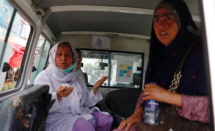 REUTERS/Mohammad Ismail Afghan women sit in an ambulance after being rescued by security forces during an attack and gunfire at a hospital in Kabul, Afghanistan May 12, 2020. REUTERS/Mohammad Ismail