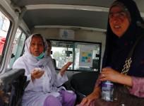 Afghan women sit in an ambulance after being rescued by security forces during an attack and gunfire at a hospital in Kabul, Afghanistan May 12, 2020. REUTERS/Mohammad Ismail