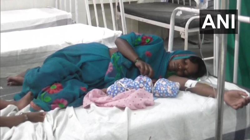 migrant woman with her baby in hospital in Satna migrant woman with her baby in hospital