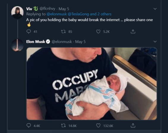 Elon Musk holding baby