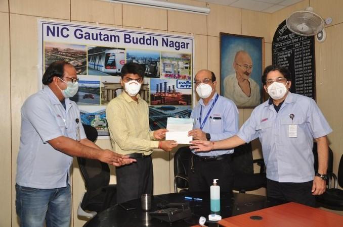 Mr Suhas Lalinakere Yathiraj, DM, Gautam Buddh Nagar, UP, receiving a cheque of Rs 25 lakh from Mr. Sanjiv Paul, Senior VP, and Mr. Vimal Raina, VP, Yamaha India Mr Suhas Lalinakere Yathiraj, DM, Gautam Buddh Nagar, UP receiving a cheque of Rs 25 lakh from Mr. Sanjiv Paul, Senior VP, and Mr. Vimal Raina, VP, Yamaha India