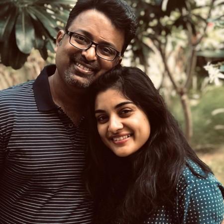 Nivetha Thomas with her father. Nivetha Thomas