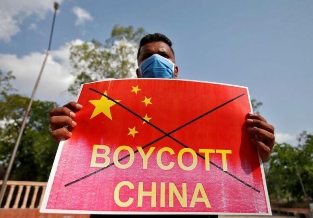 Member of NSUI holds a placard during a protest against China, in Ahmedabad. Reuters protests